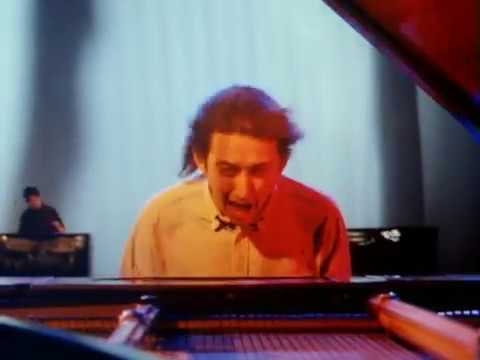 Friday Song: “Living in Another World”